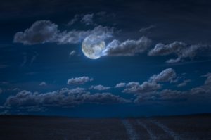 Moon and clouds in the night. Moonlight and road background.