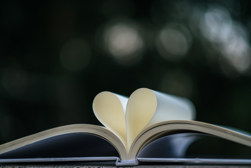 Open book with shape heart